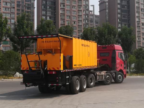 Why is it necessary to add water to the road maintenance slurry seal